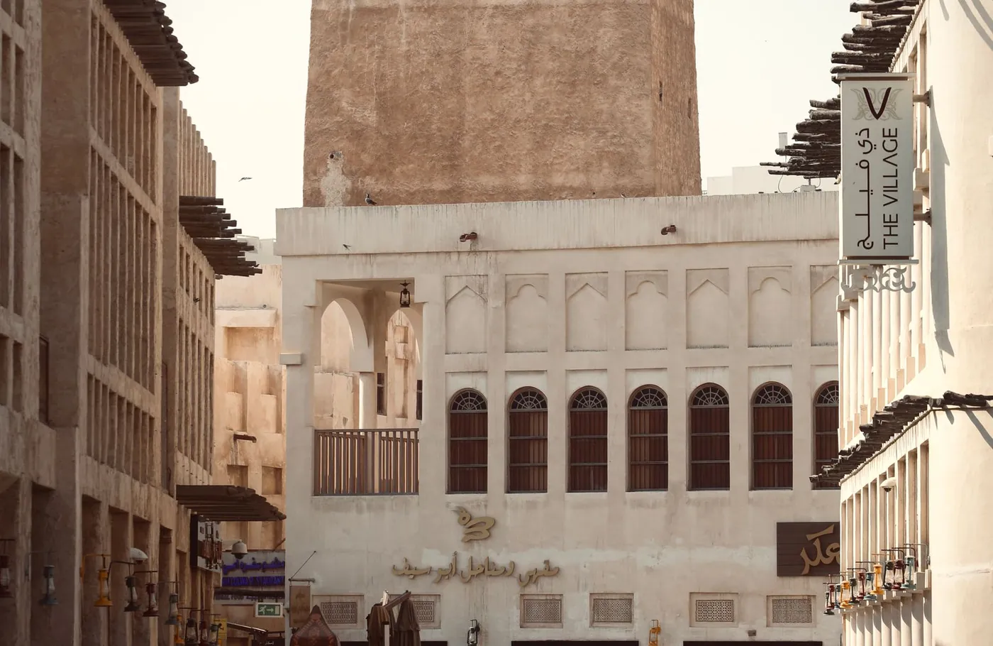 Traditional sand-coloured buildings along a passage in Souq Waqif, Doha